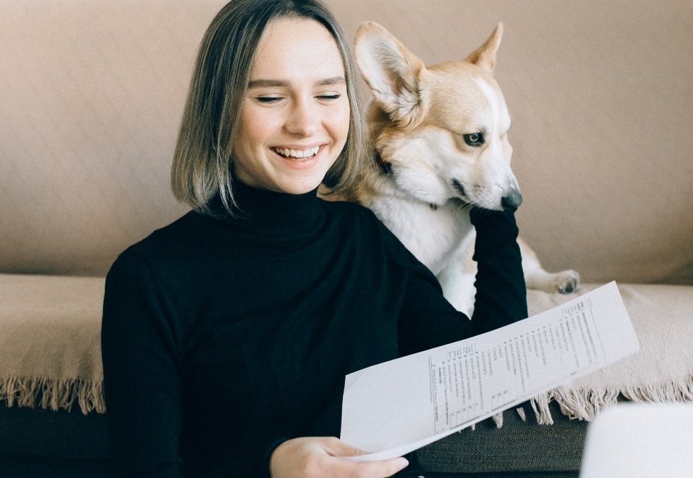 reading book with pet Signature Music Row Midtown Nashville Apartments
